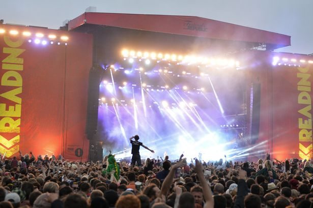 A crowd of festival music fans enjoy the music and atmosphere during Reading Festival